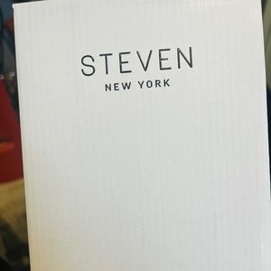 Spikes on top of sandals. Shoes have been thoroughly sanitized.